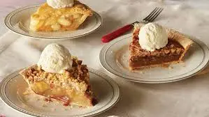 "Cracker Barrel dessert menu featuring Southern sweets like double chocolate fudge cake, fruit cobbler, and baked apple dumplin’"

