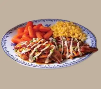 Grilled chicken breast topped with maple glaze and crispy bacon