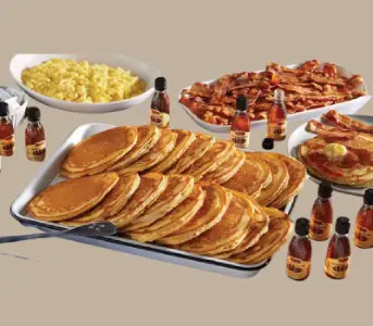 Momma’s Pancake Breakfast at Cracker Barrel with fluffy pancakes, eggs, and bacon.

